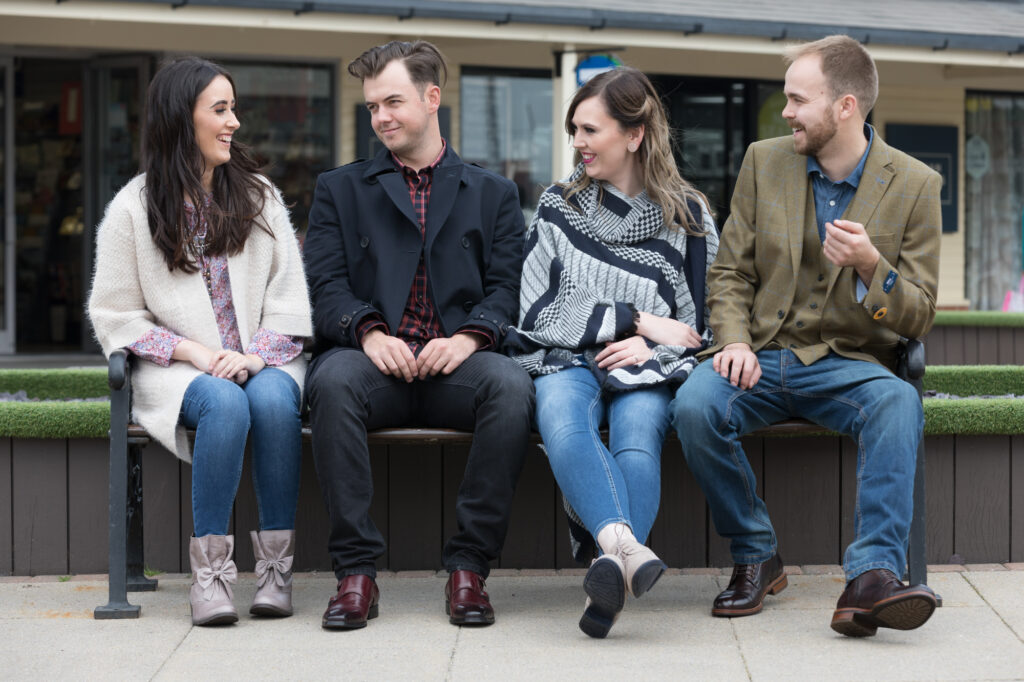 Unit stills photography on location in Fleetwood, four people sitting on a bench